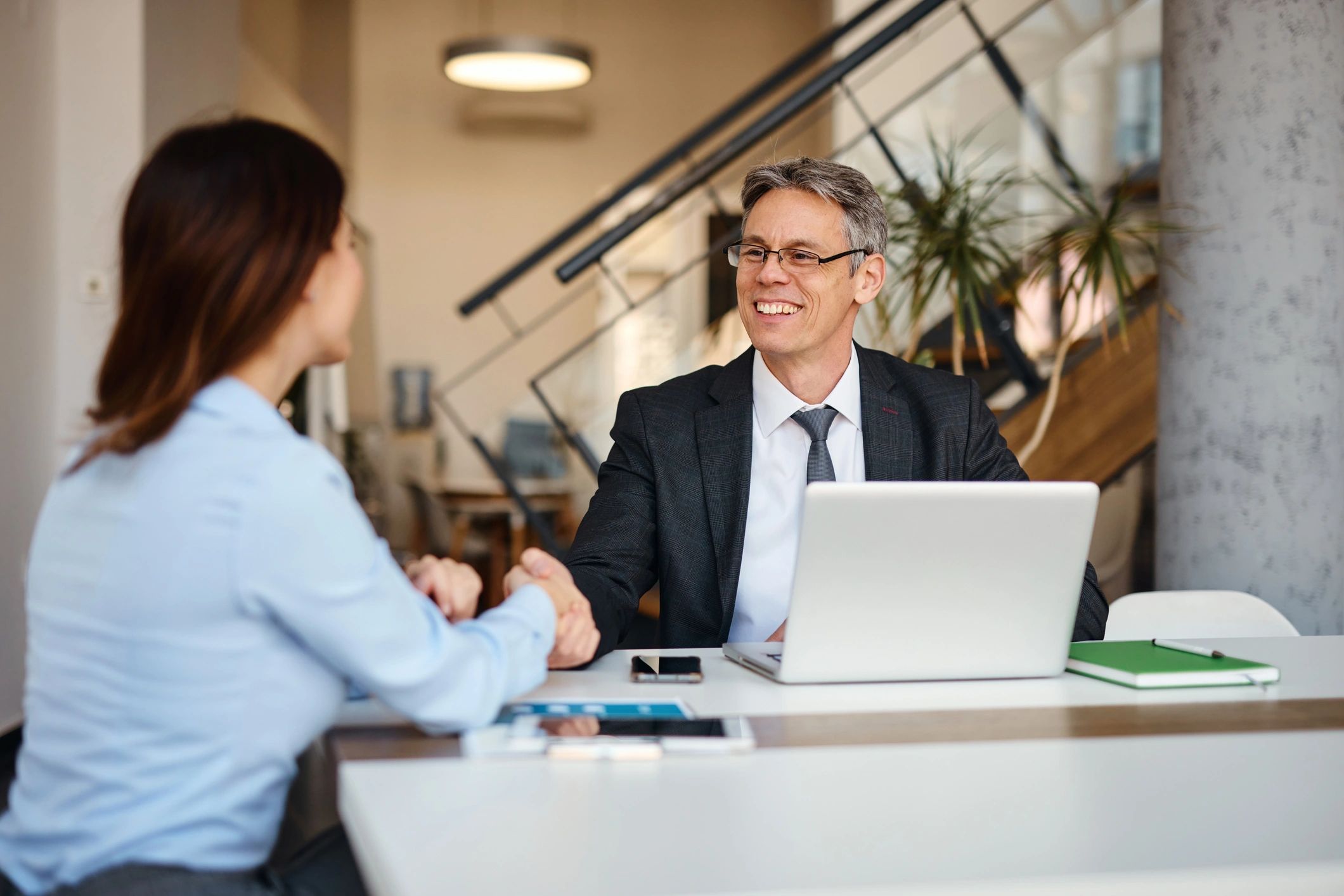 Insurance consultation meeting with a handshake